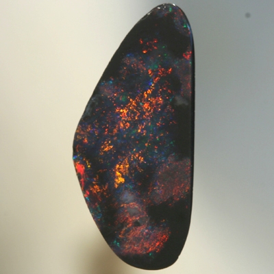 SOLID BLACK OPAL Red fire moves between black opal